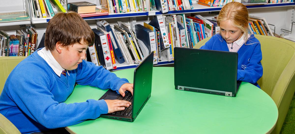 Children using some laptops.
