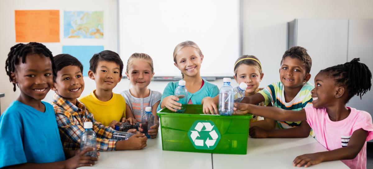 Children recycling together 