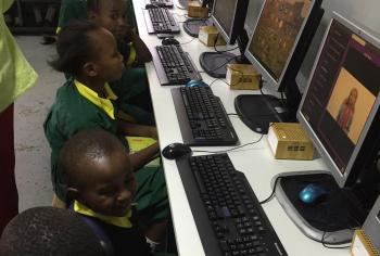 Children use computers in the Malezi Digital Hub