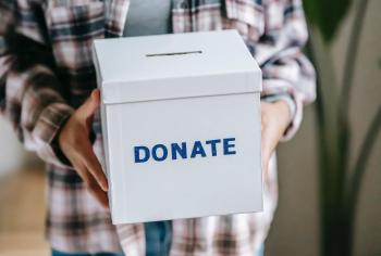 woman with charity donation box