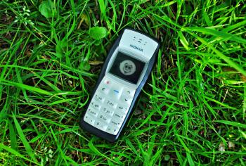 A mobile phone in the grass