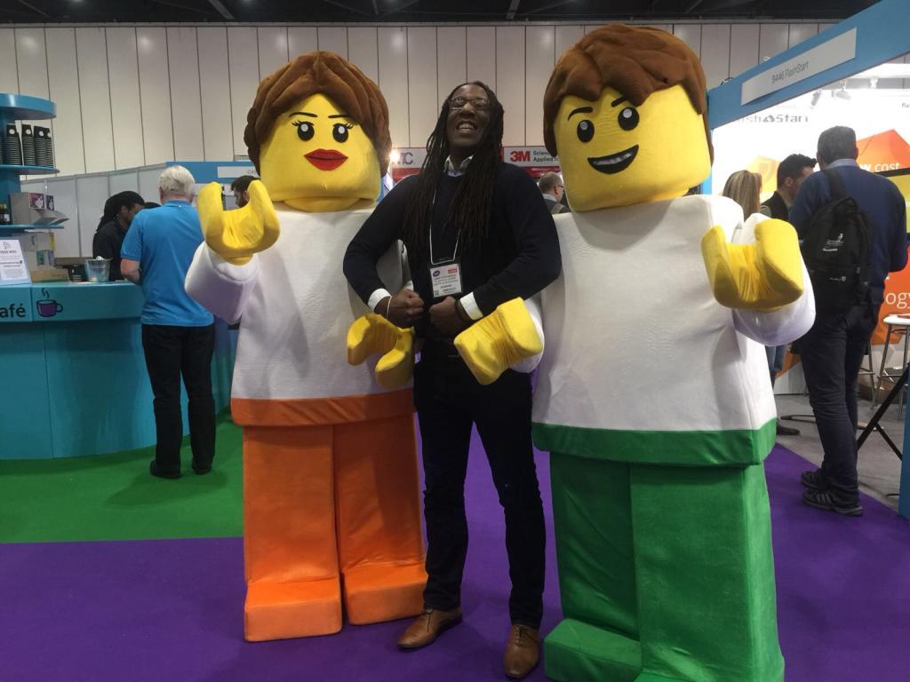 Darren standing with two lego people