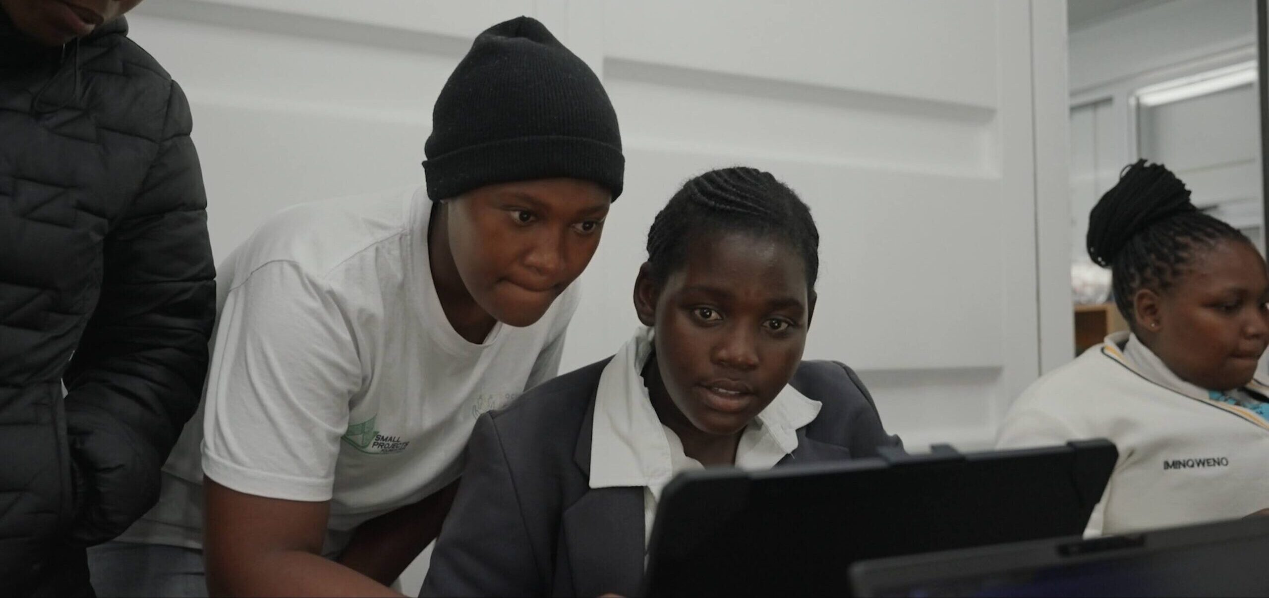 Young students using laptops